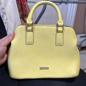 ALDO yellow purse. Comes with crossbody strap. Excellent condition.